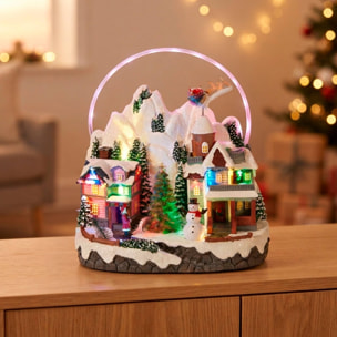 Pueblo navideño led con movimiento, escena de invierno bajo arco iris 27x17,9x30cm