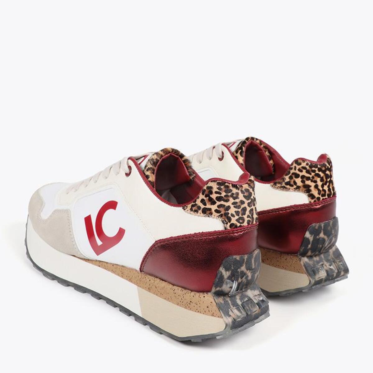 Scarpa da ginnastica con suola personalizzata e stampa animalier e dettagli in pelle