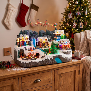 Pueblo navideño con trineo de papá noel con luces led, movimiento y música, usb o pilas 59,5x35,5x38,5 cm