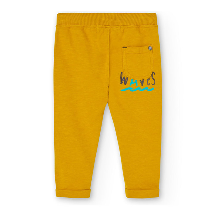 Pantalón deportivo en amarillo con cintura elástica y bolsillos