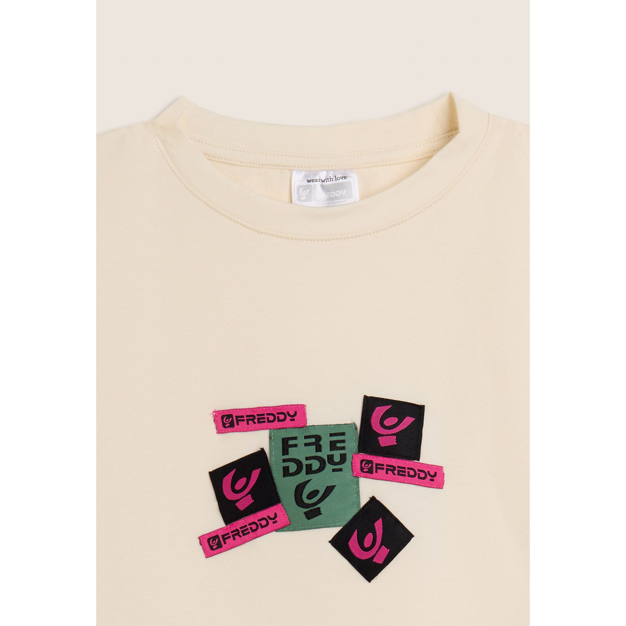 T-shirt Junior cropped con stampa loghi multipli
