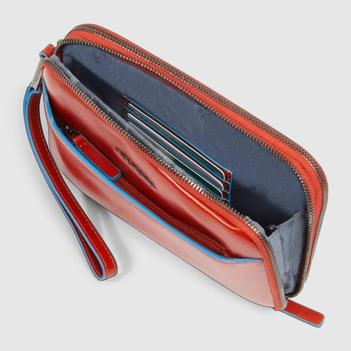 Piquadro Pochette in pelle con polsiera rimovibile e protezione RFID