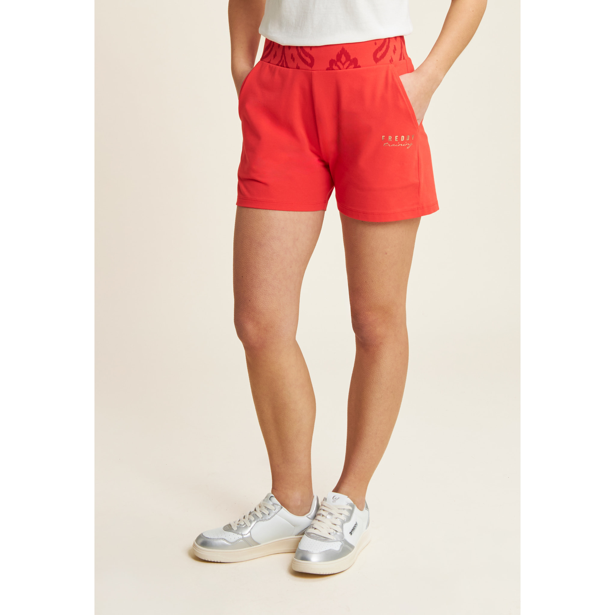 Short sportivi con fascia in vita floreale