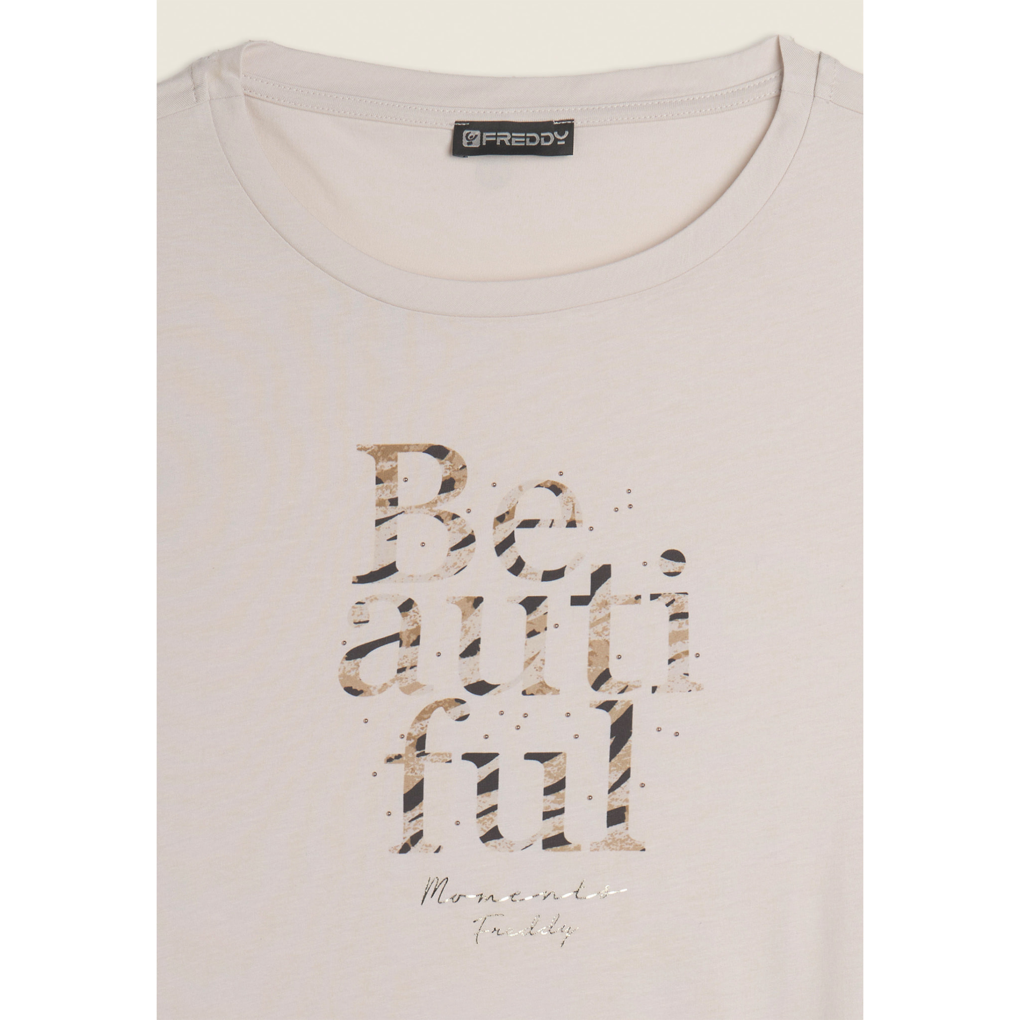 Canotta con fondo svasato e grafica con borchie