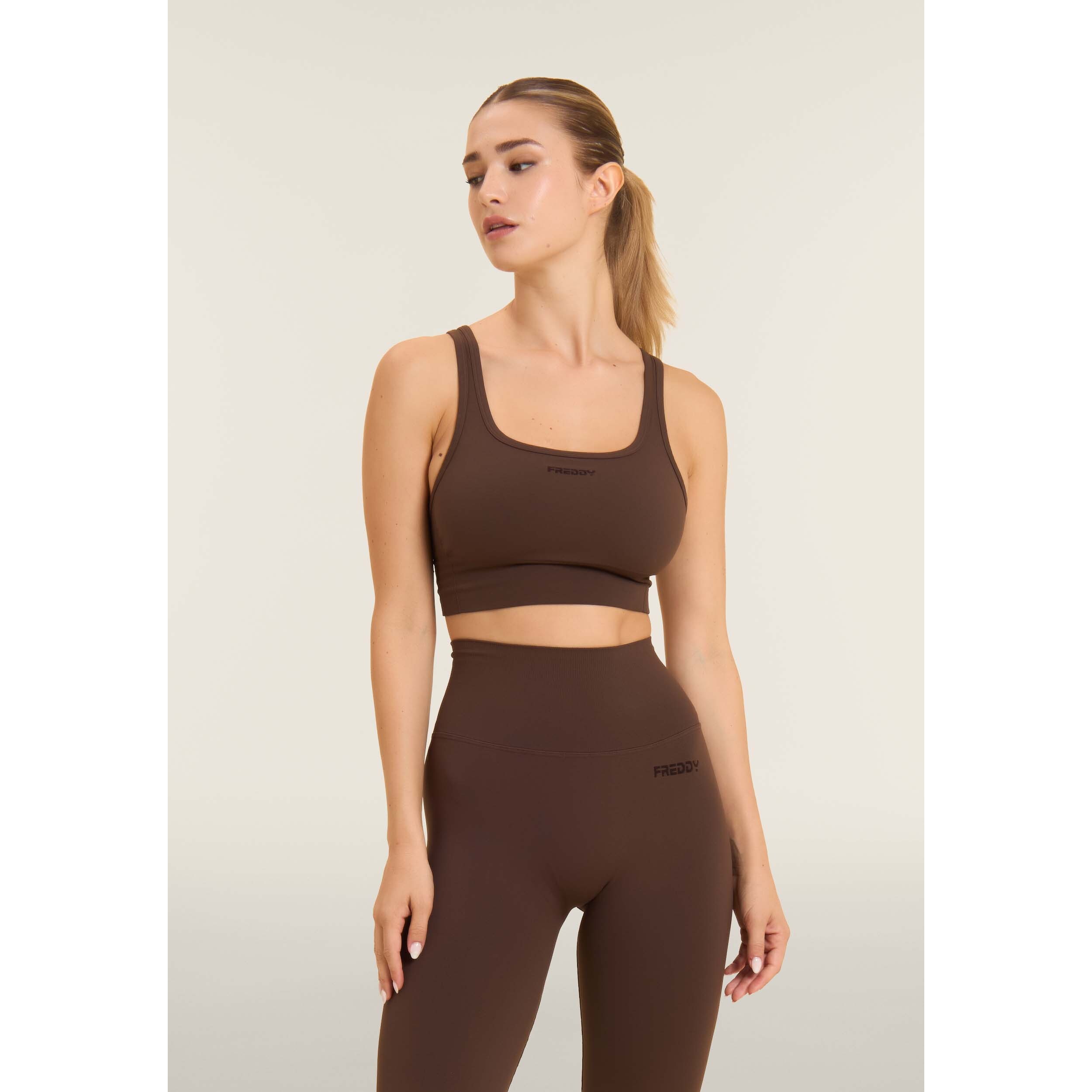 Top sportivo seamless supporto medio con inserti a costine