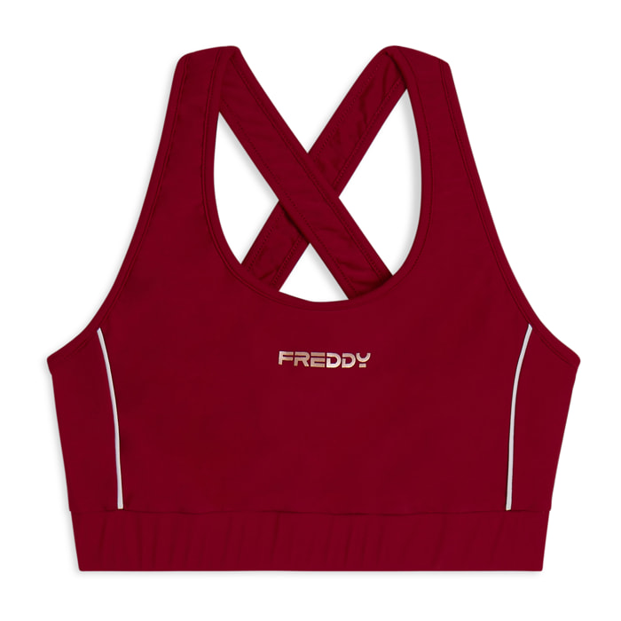 Top tecnico con spalline incrociate e profili bianchi