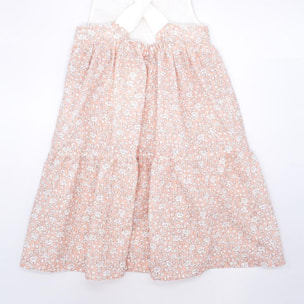 Vestido midi de flor rosa. Falda de volantes y tirantes cruzados en la espalda.