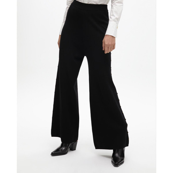 Pantaloni dritti con borchie laterali