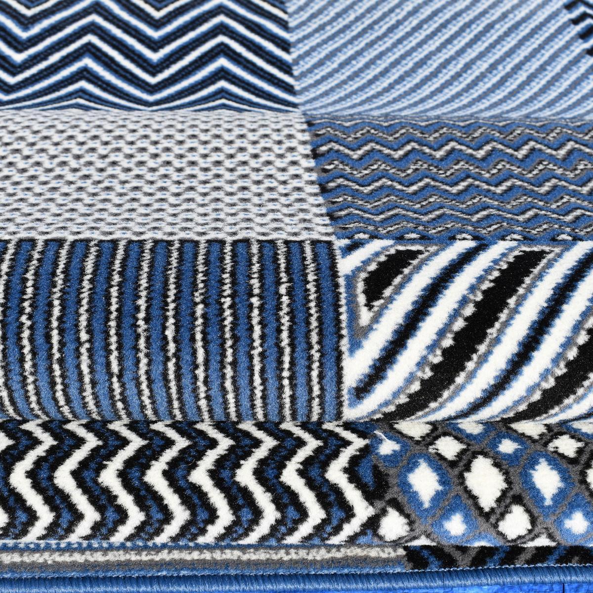 Tapis Dufi motif géométrique différentes teintes de bleu