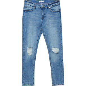 Jeans skinny con rotture