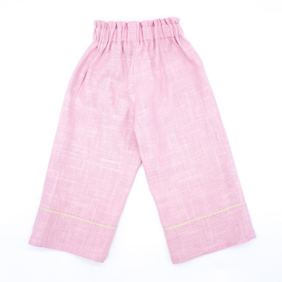 Pantalón largo de lino rosa. Elastico en la cintura, picunela en el bajo.