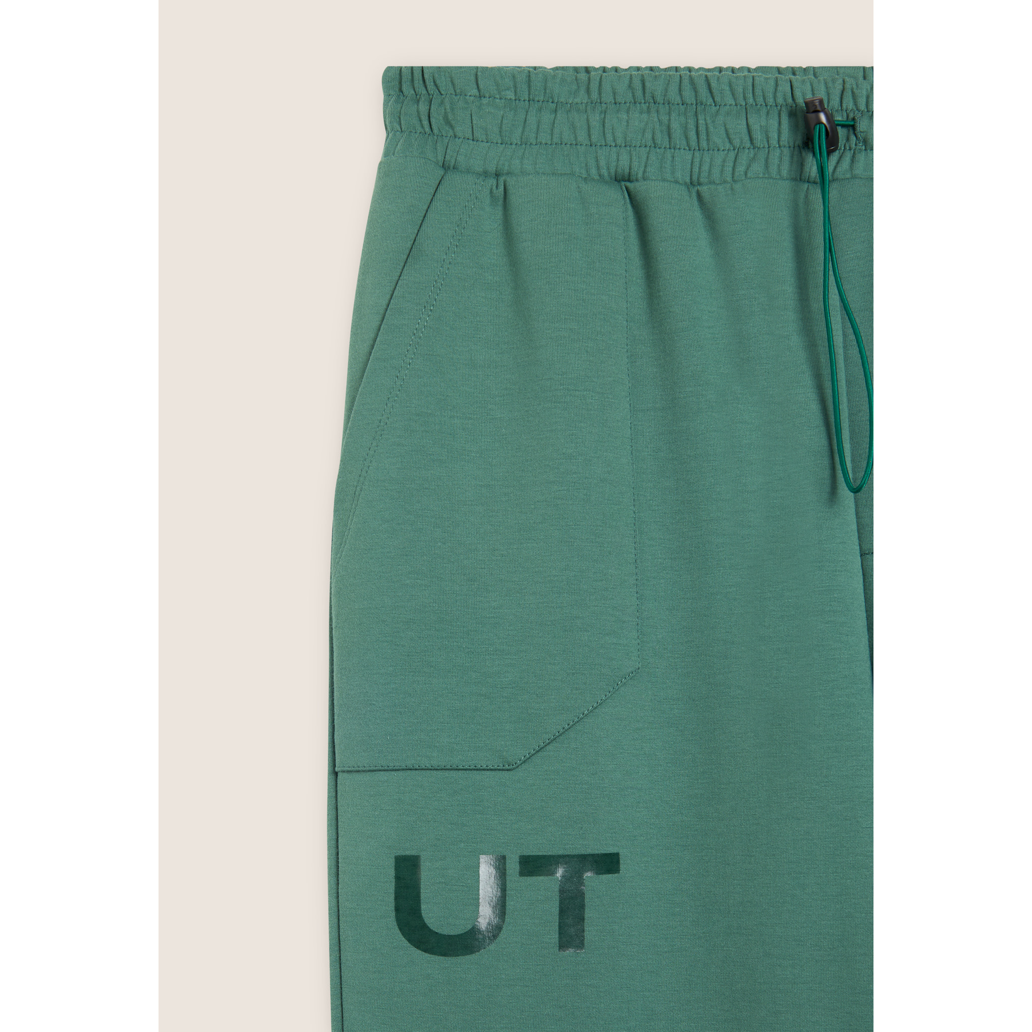 Pantaloni slim in interlock con stampa UT e cuciture