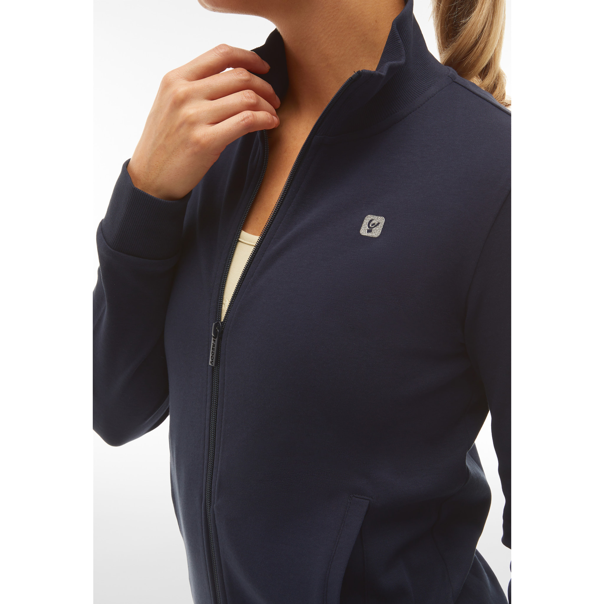 Tuta sportiva in interlock con felpa collo alto e zip