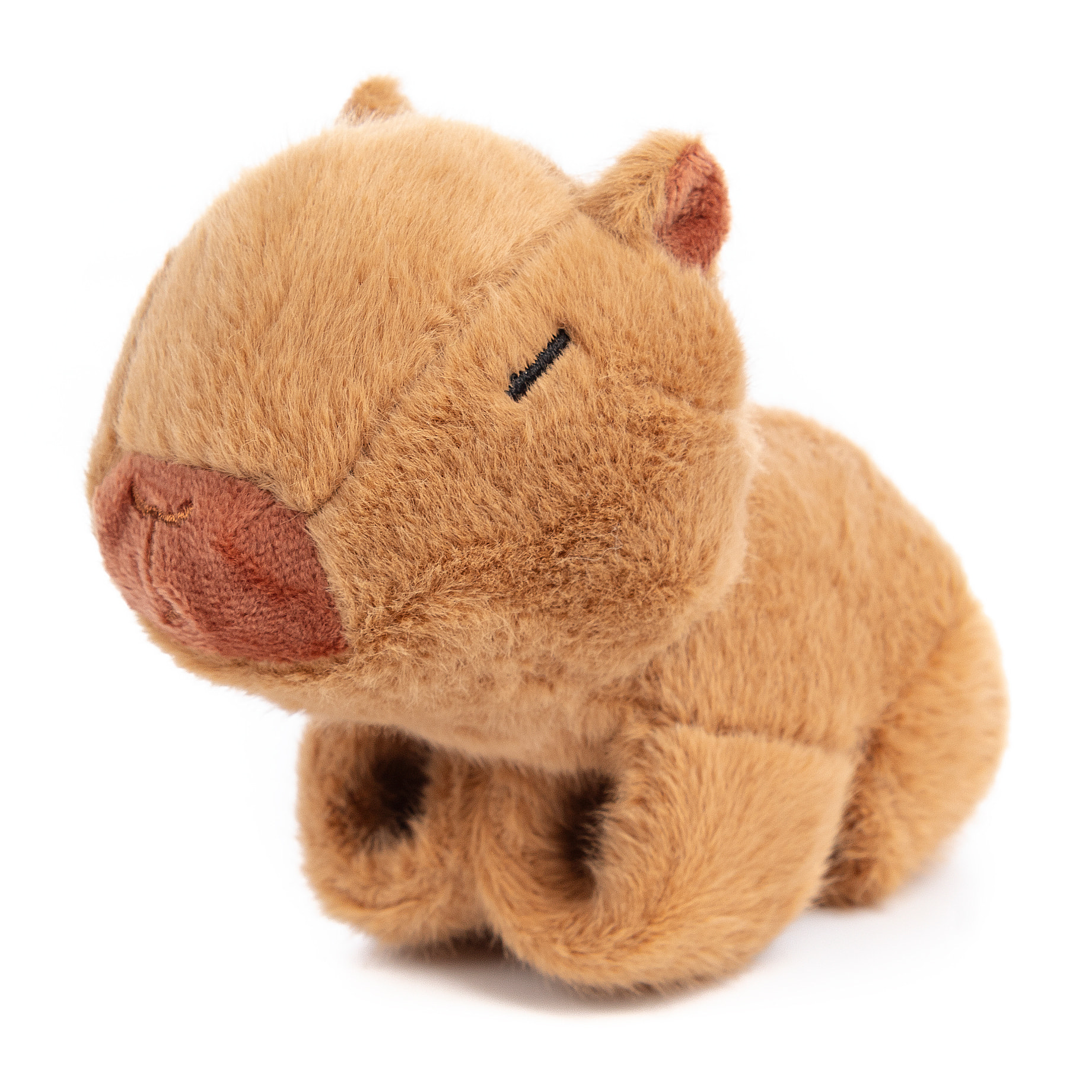 Peluche extrasuave y mullido. Diseño capibara con mecanismo enrollable. 14 cm.