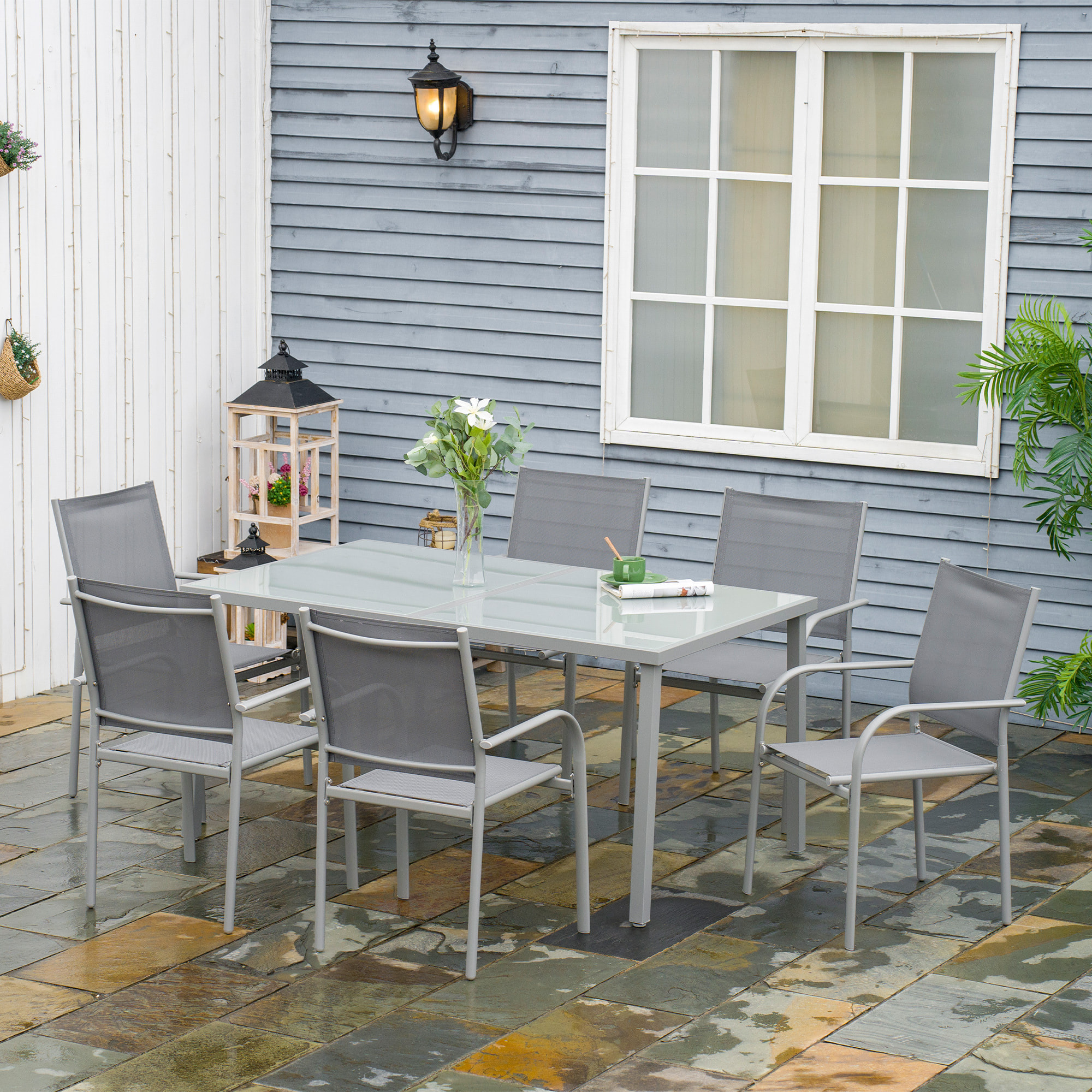 Ensemble de jardin 6 personnes chaises empilables table à manger dim. 150L x 90l x 72H cm plateau verre acier époxy textilène gris