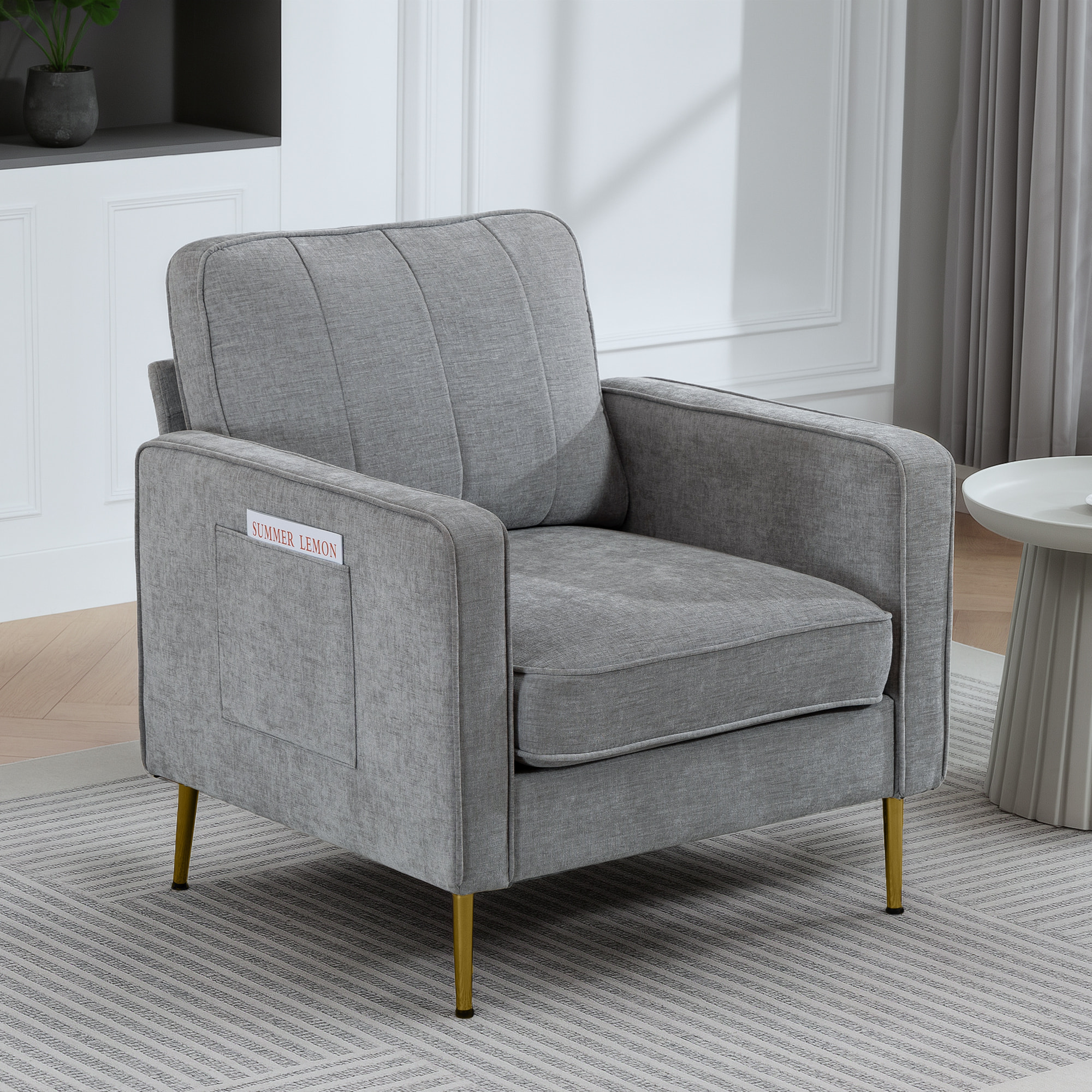 Fauteuil style art déco piètement métal doré tissu gris clair