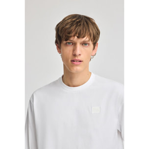 Camiseta blanca holgada con detalle Polo Club