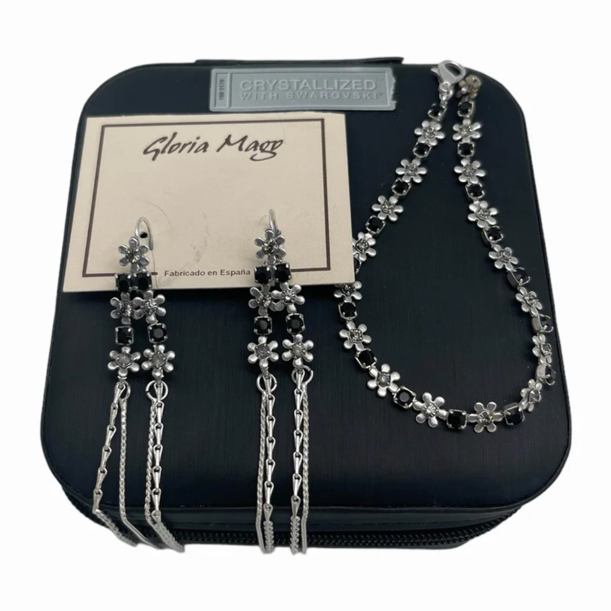 Joyero de viaje y Conjunto de Swarovski pendientes largos y pulsera con detalles de flor. Plata de ley 7-10 micras en color negro