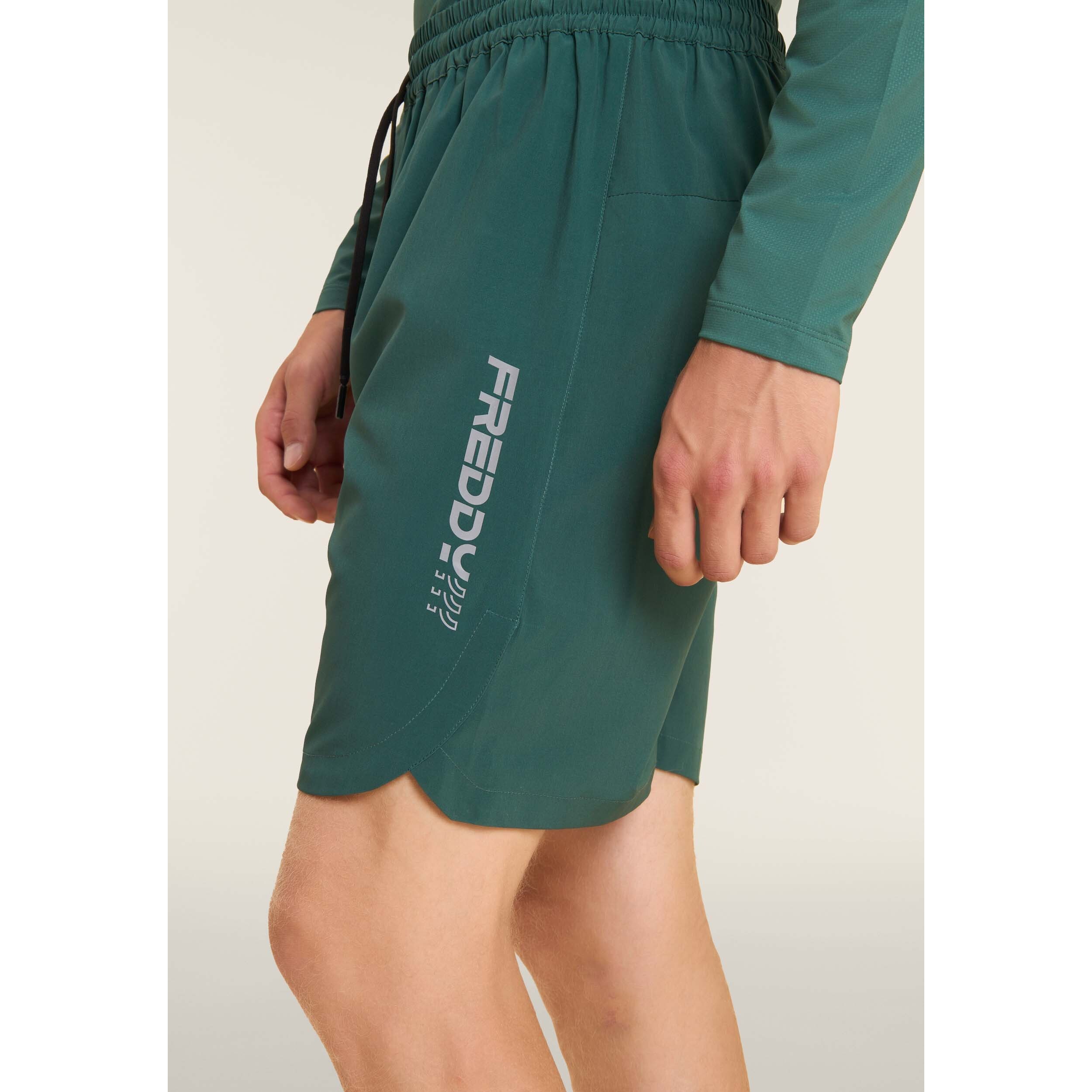 Shorts slim con tasche zip e coulisse in vita