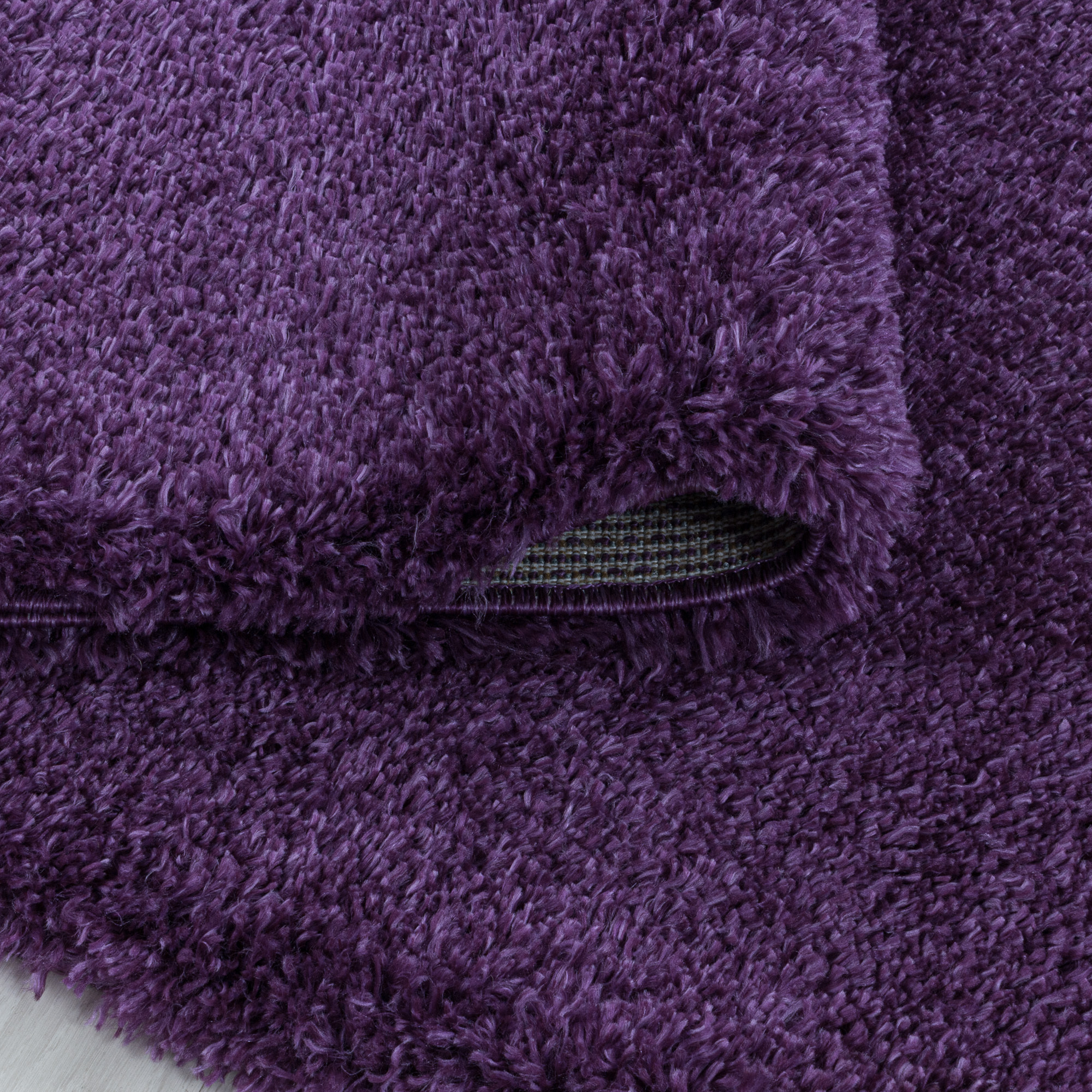 FLUFFY - Tapis rond shaggy uni à poils longs Lila