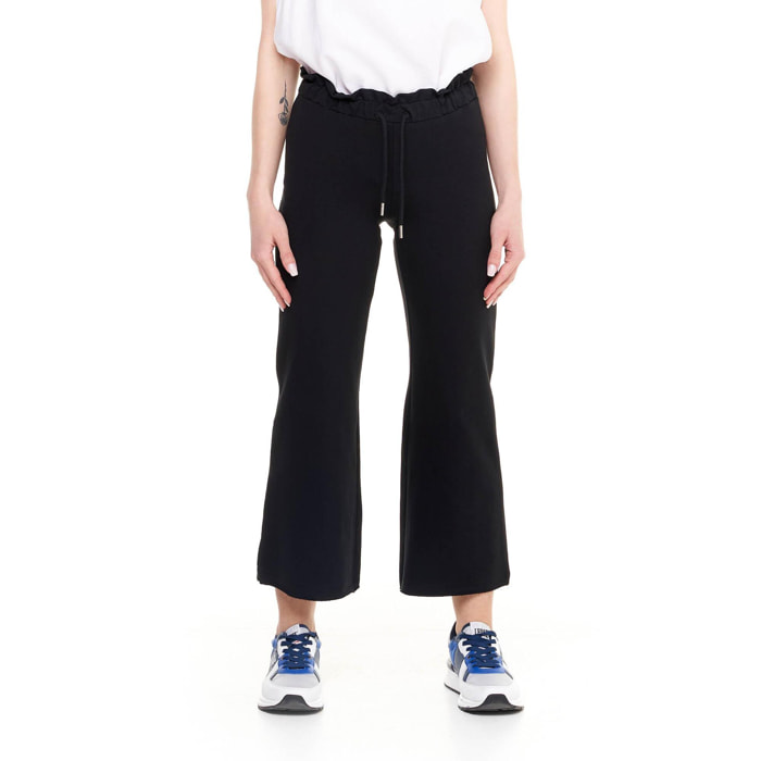 Pantalones deportivos de mujer brillantes hasta los tobillos