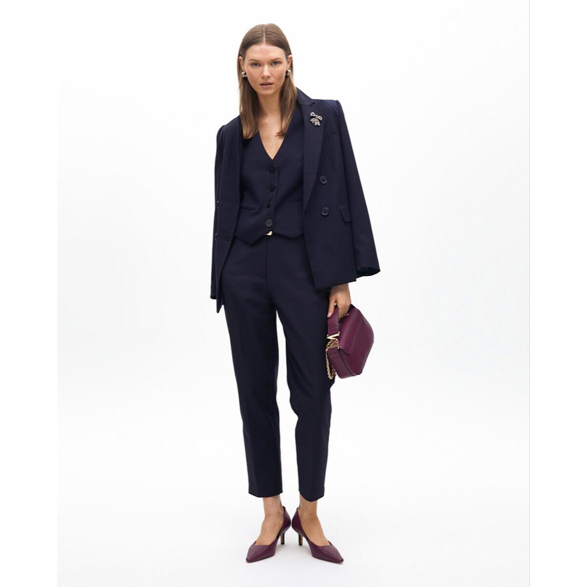 Pantaloni chino con elastico logato e strass