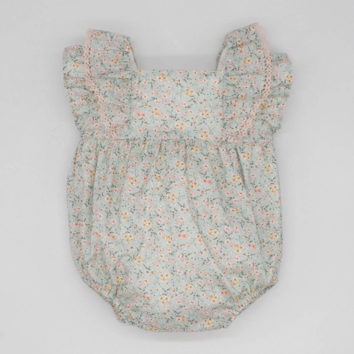 PELELE VERDE FLORECITAS Y LAZO ROSA