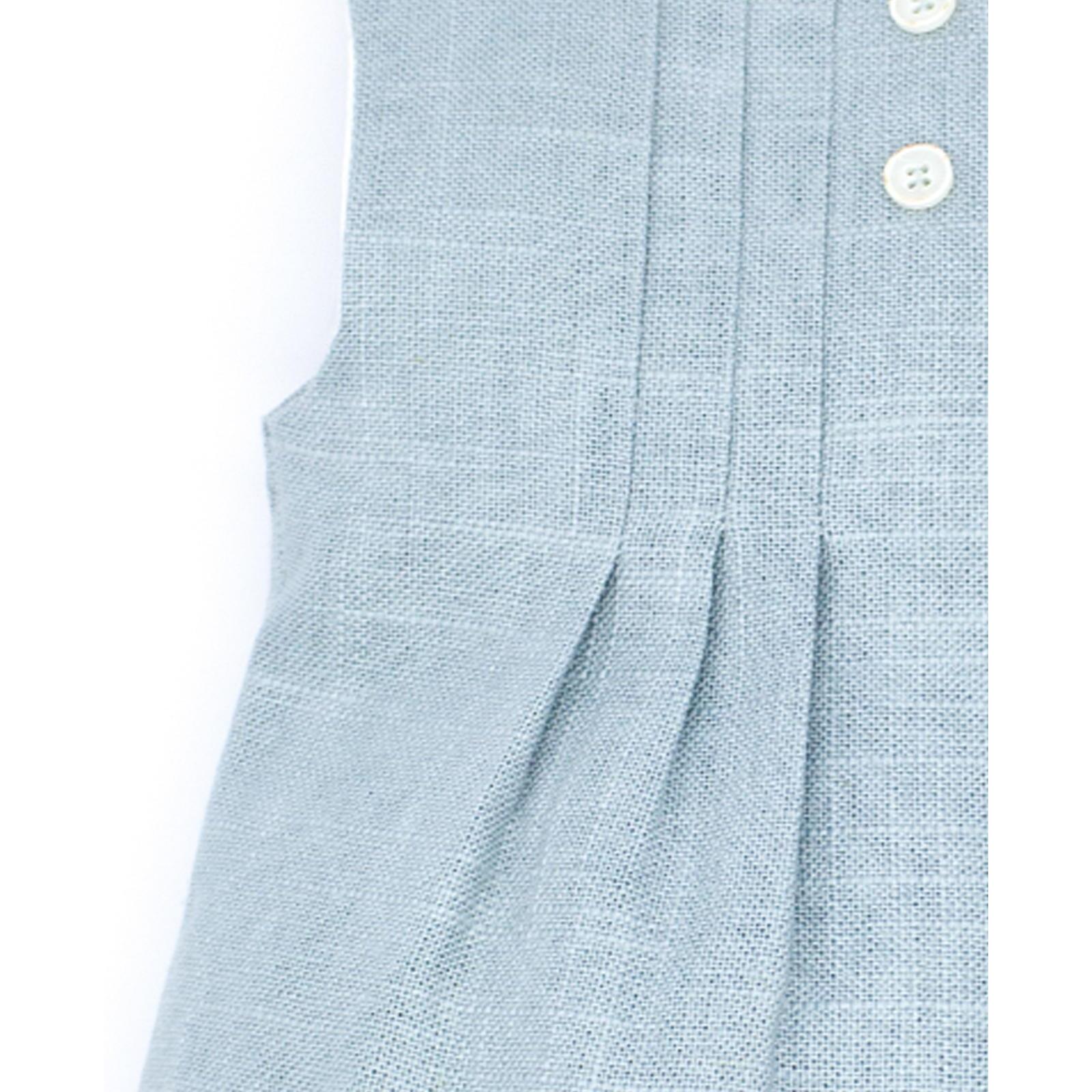 Pelele de lino verde. Con pliegues en el delantero y botones de decoracion.