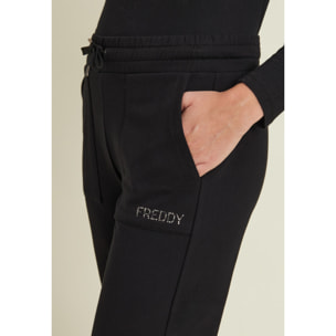 Pantaloni con fondo elasticizzato e tasche applicate