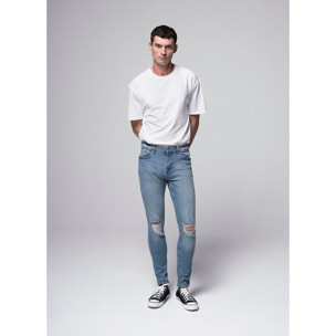 Jeans skinny con rotture