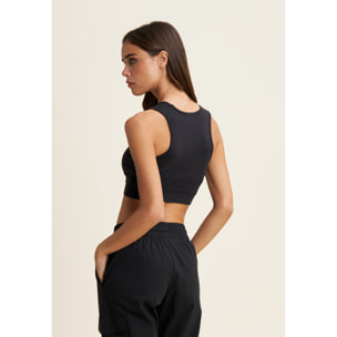 Top sportivo supporto medio in jersey con grafica dorata