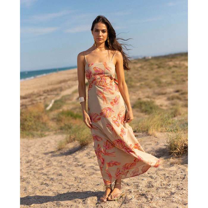 Vestido midi con bordado floral, espalda descubierta y lazada ajustable.