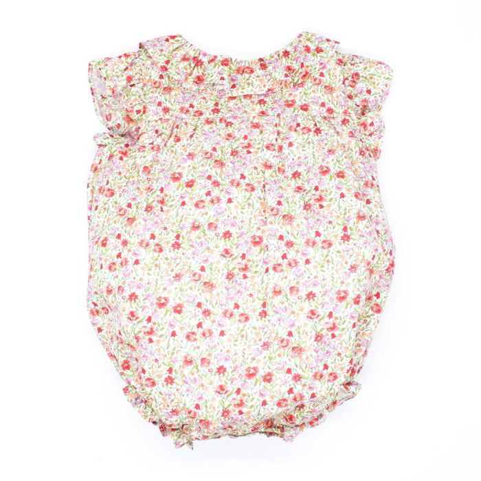 Pelele estampado flor roja, con volante en el cuello y en la sisa.