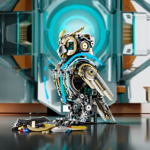 Maqueta 3D mecanizada de buho con 1296 piezas, equipada con luces y mecanismo de manivela que permite movimiento dinámico.