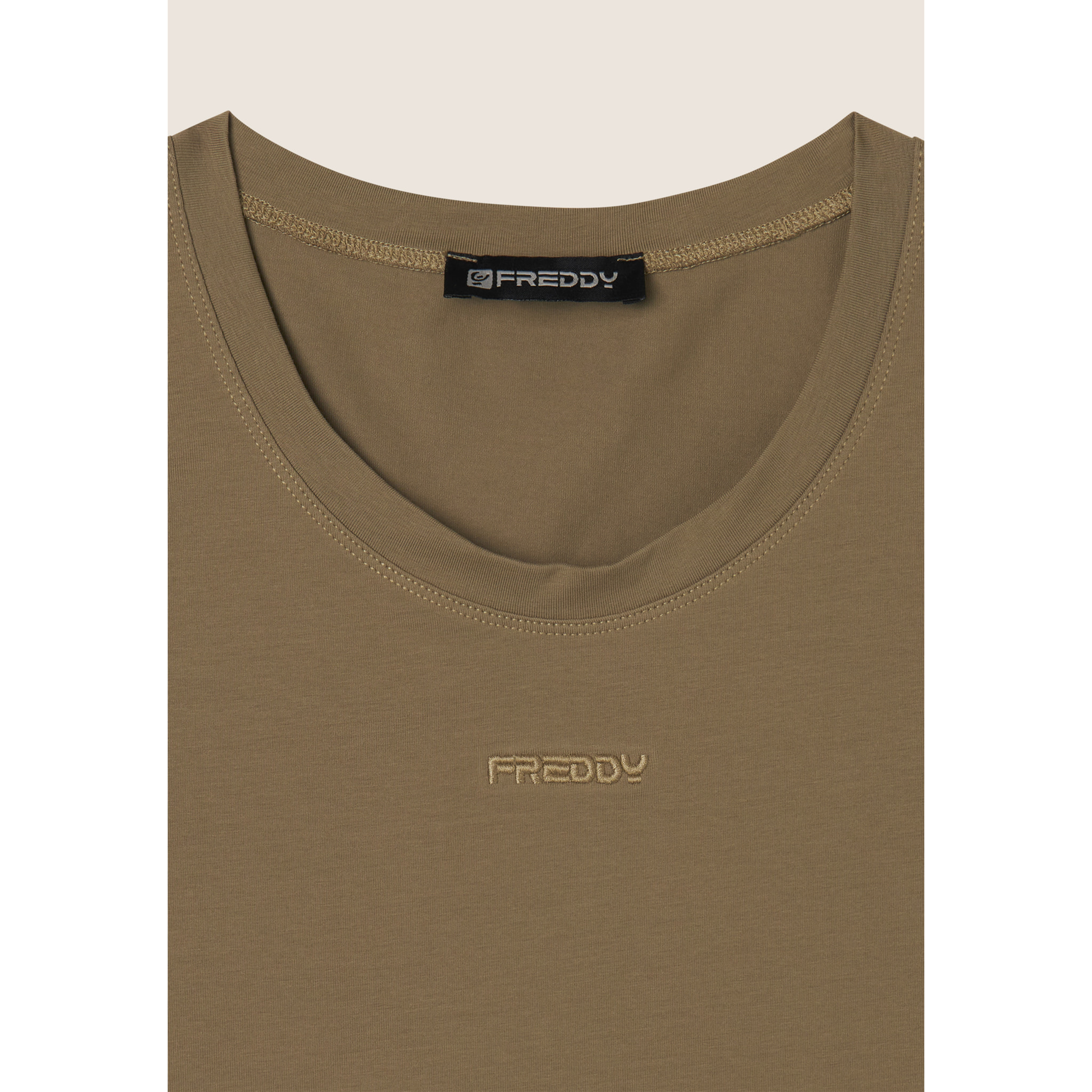 Top sportivo in heavy jersey stretch con elastico logato