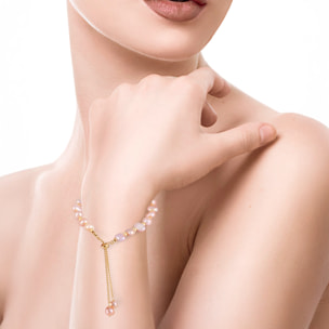 Pulsera ajustable de perlas naturales en tonos rosados.