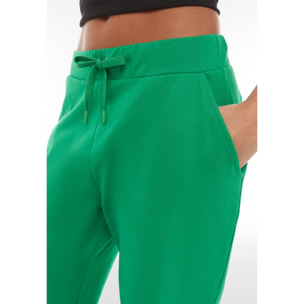 Pantaloni carrot fit in french terry con grafica sul fondo