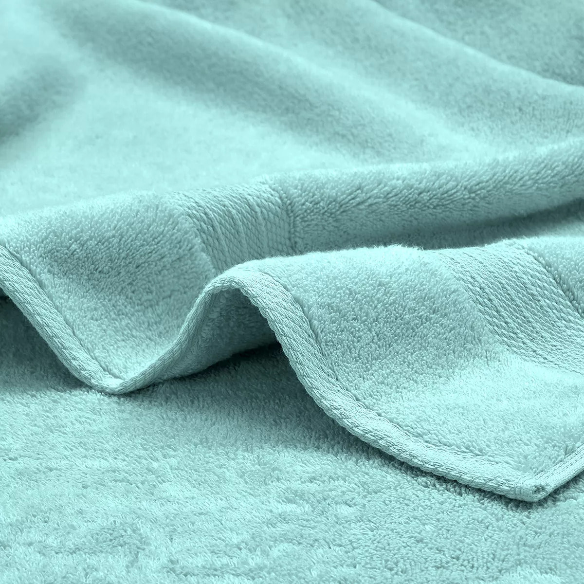 Serviette invites pur coton 550 g/m² uni bleu Elea curacao