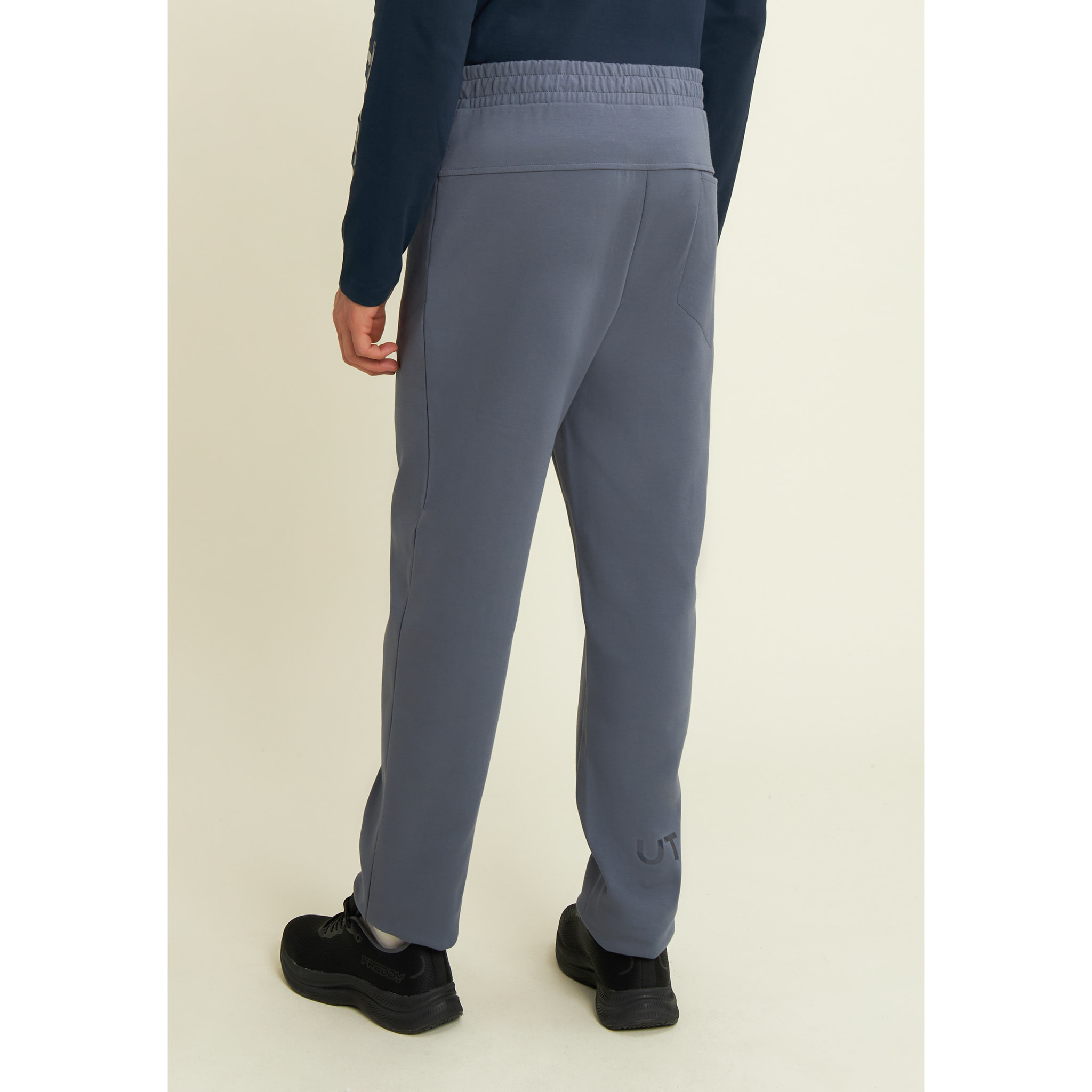 Pantaloni slim in interlock con dettagli lucidi
