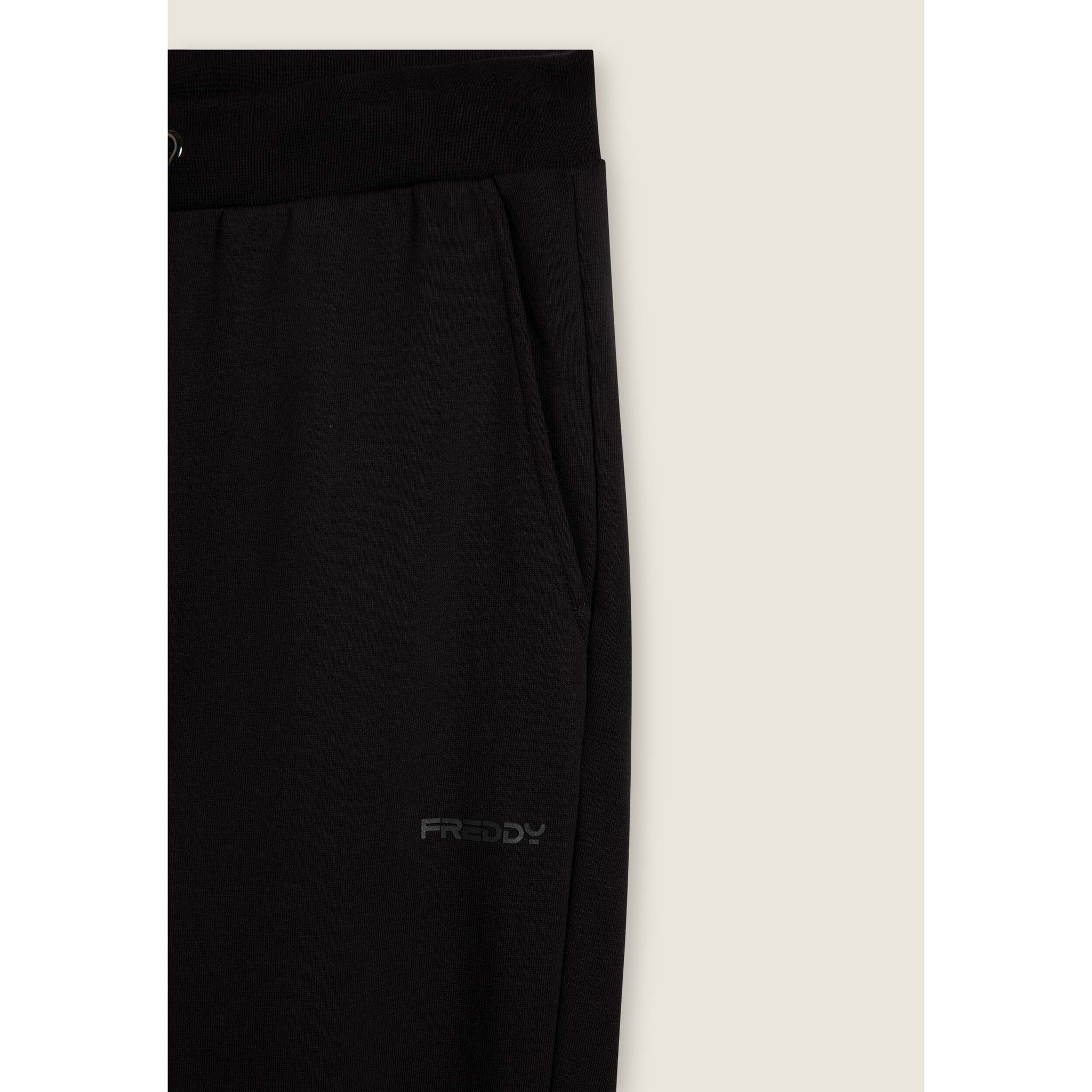 Pantaloni regular in felpa garzata con fondo in costina