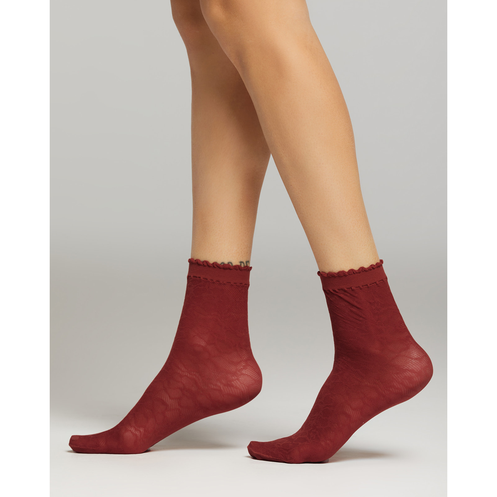 Calza Miuccia con motivo pizzo macro