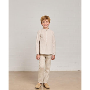 Camisa de rayas de lino natural. Cuello mao y tapeta con botones.