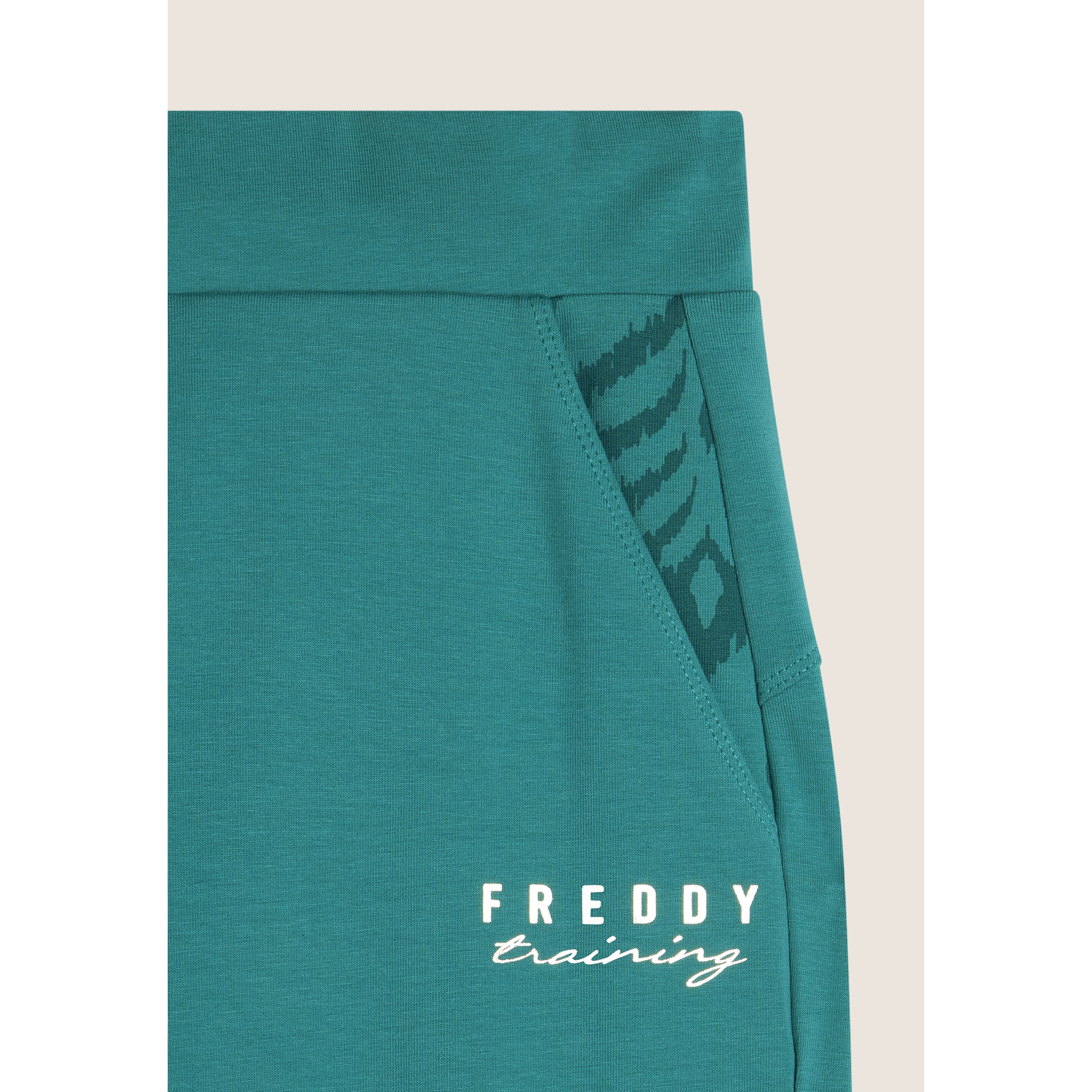 Pantaloni slim fit in jersey con dettagli floreali