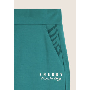 Pantaloni slim fit in jersey con dettagli floreali