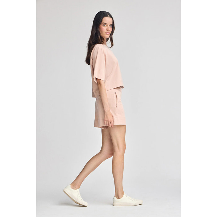 Pantaloncini in cotone nude con logo ricamato