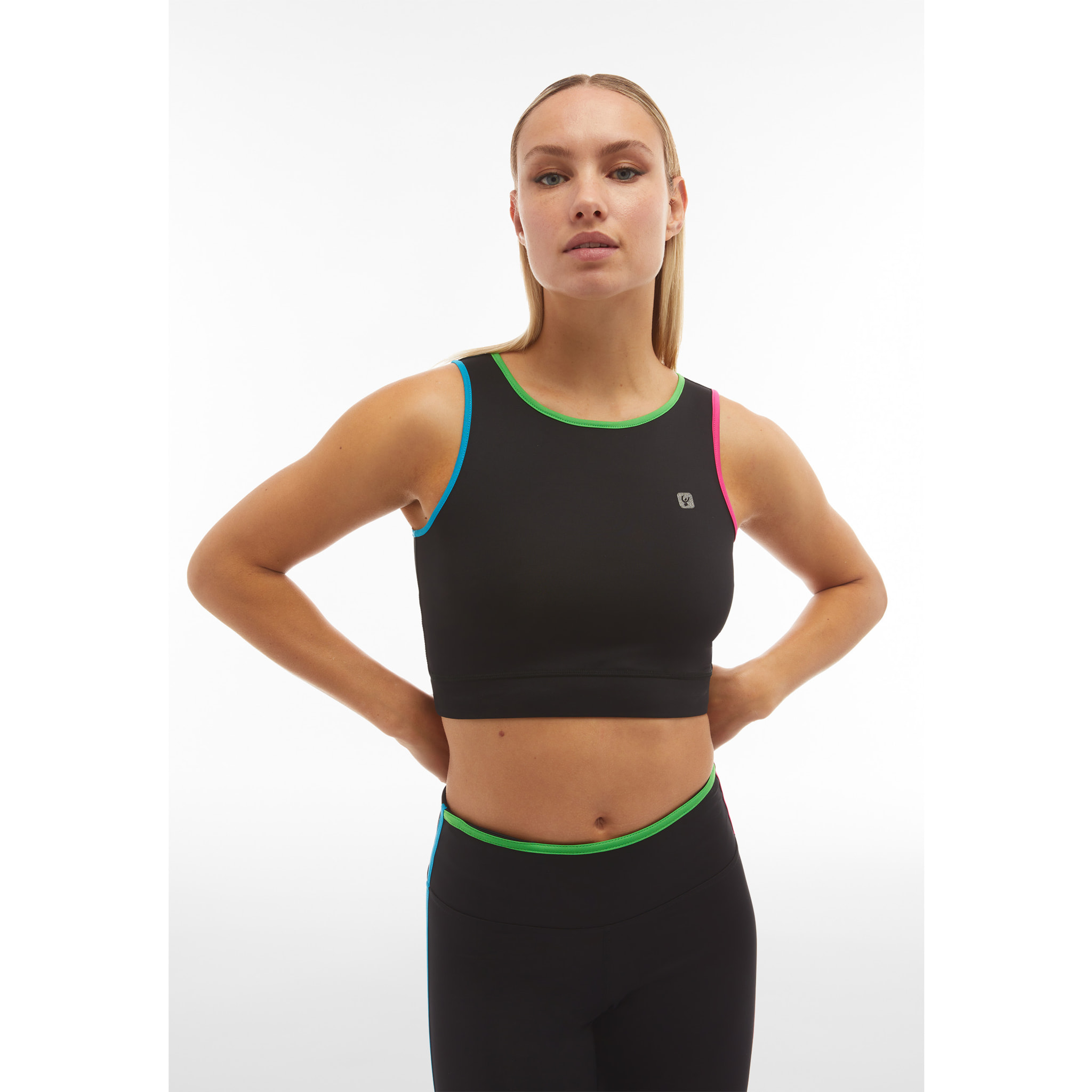 Top fitness a sostegno medio con bordature colorate