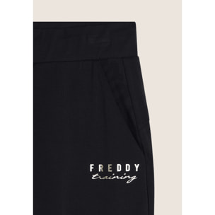 Pantaloni slim fit in jersey con dettagli floreali