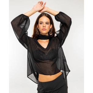 Blusa de manga larga en tejido semitransparente con lurex y lazada multiposición.