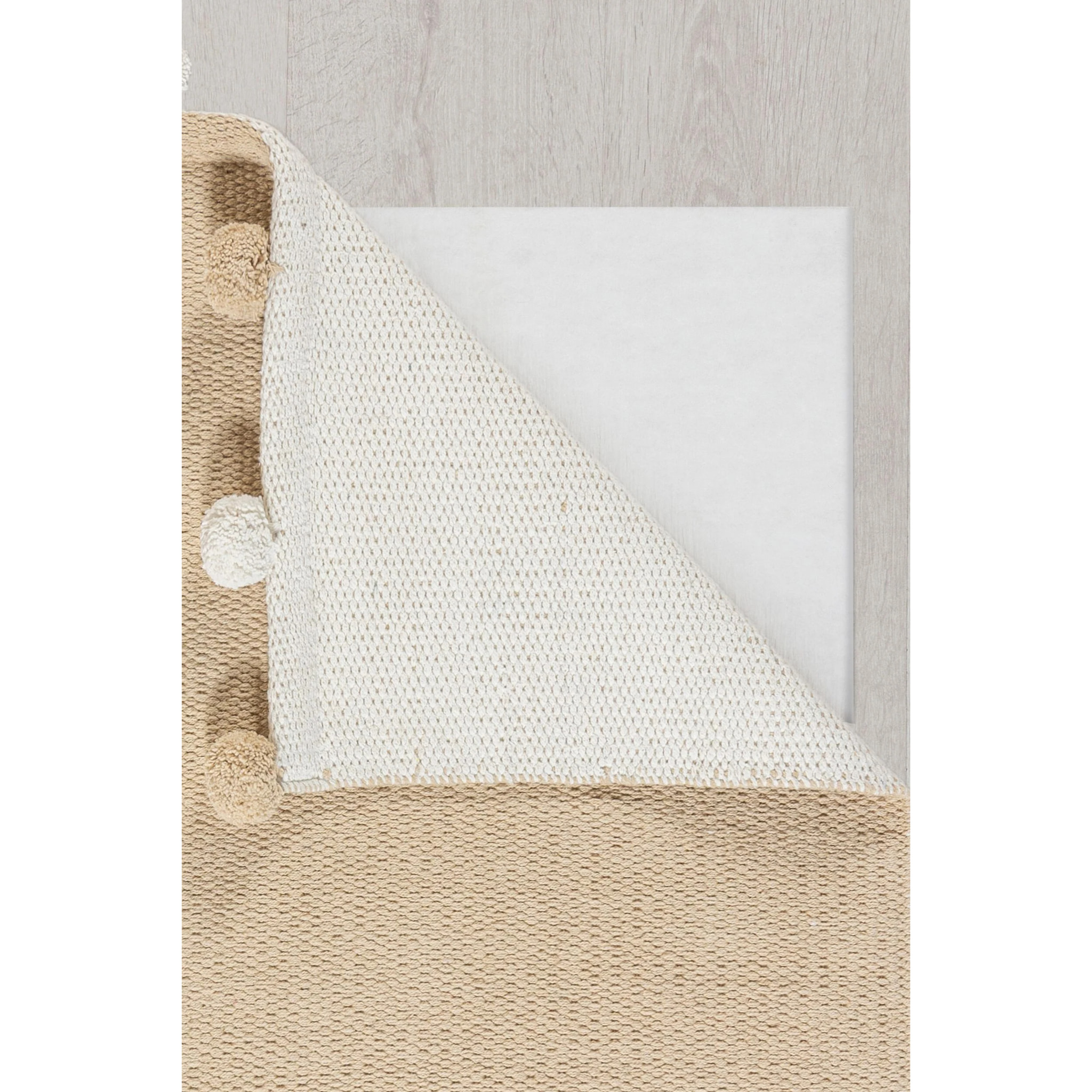 Tapis à pompon chambre enfant Beige
