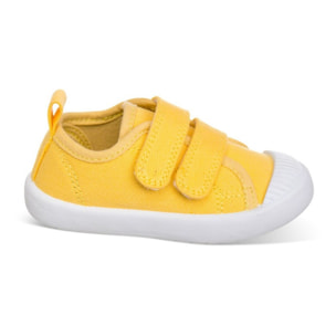 Lona color amarillo, fácil de combinar, con dos Velcros, puntera de goma y gran flexibilidad